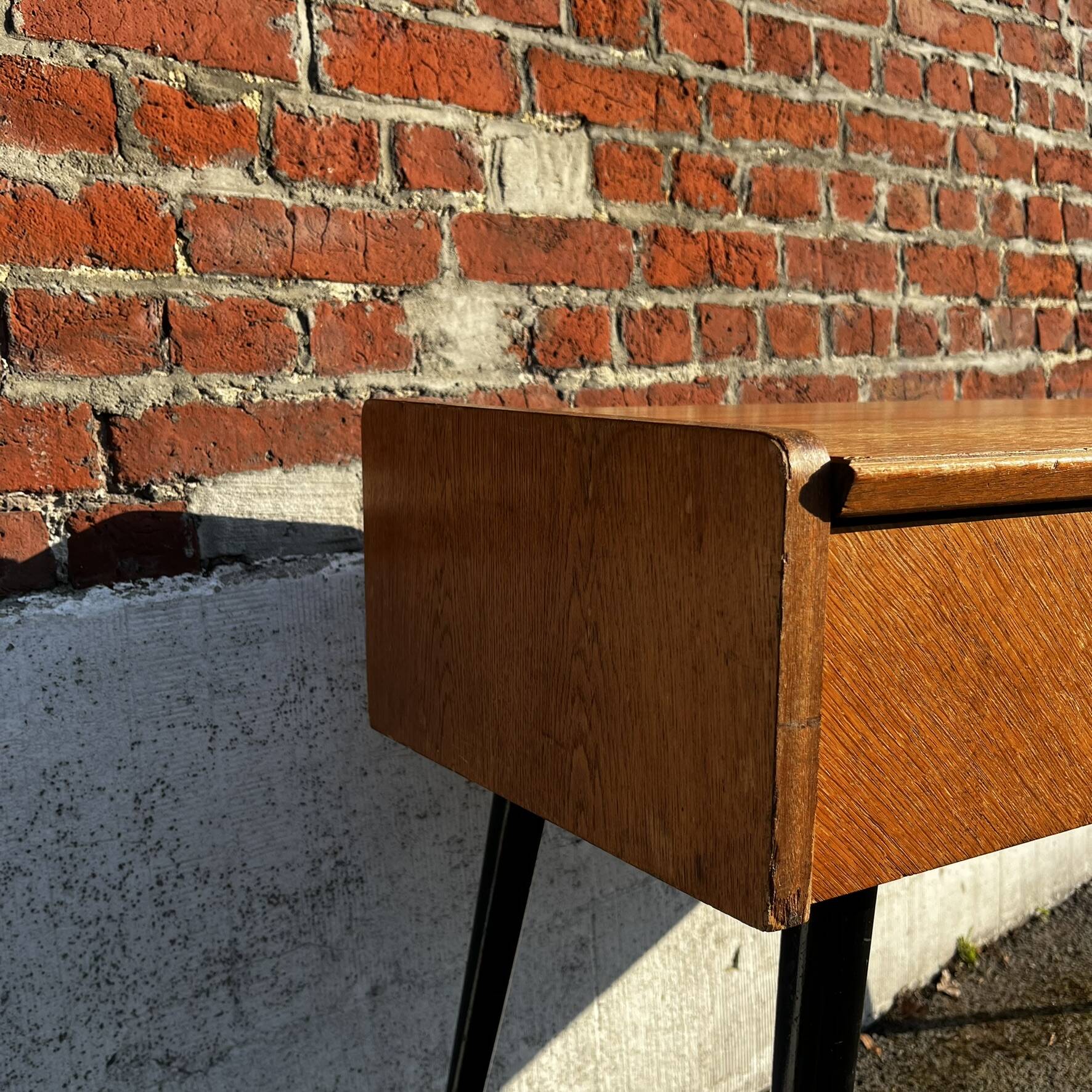 Vintage wooden console/desk with tapered legs.