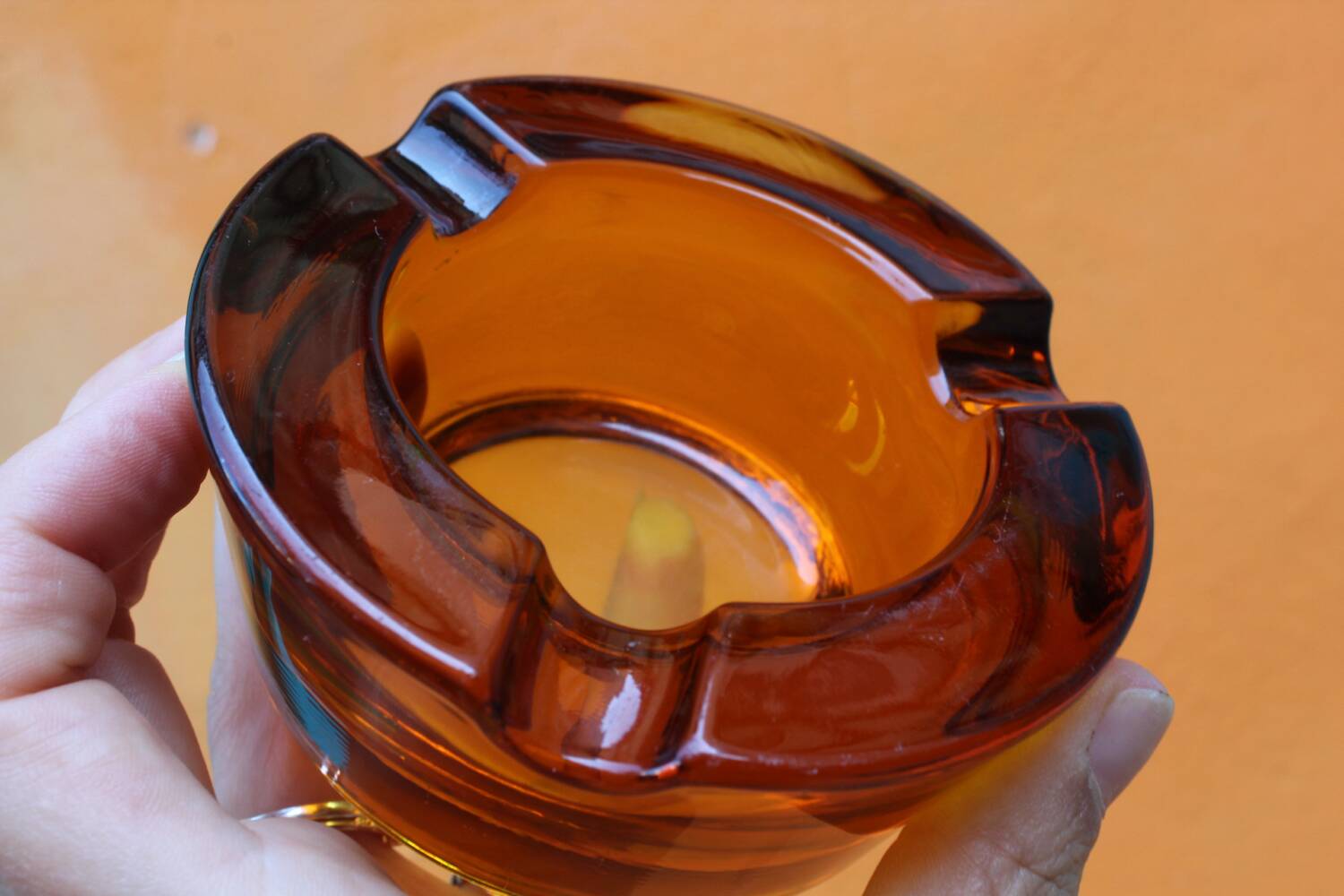 Amber glass ashtray