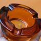 Amber glass ashtray