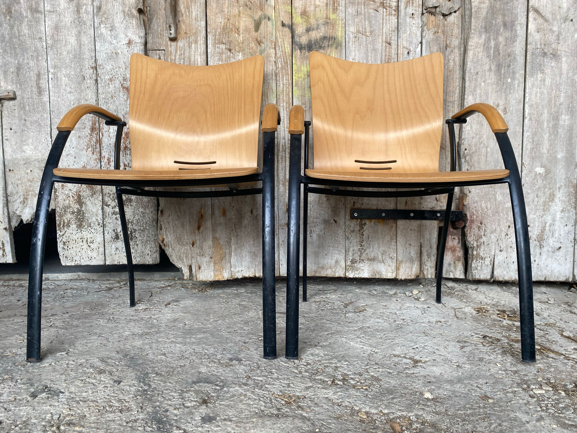 Pair of Vintage RONÉO Armchairs with Black Metal Legs + Curved Wooden Shell