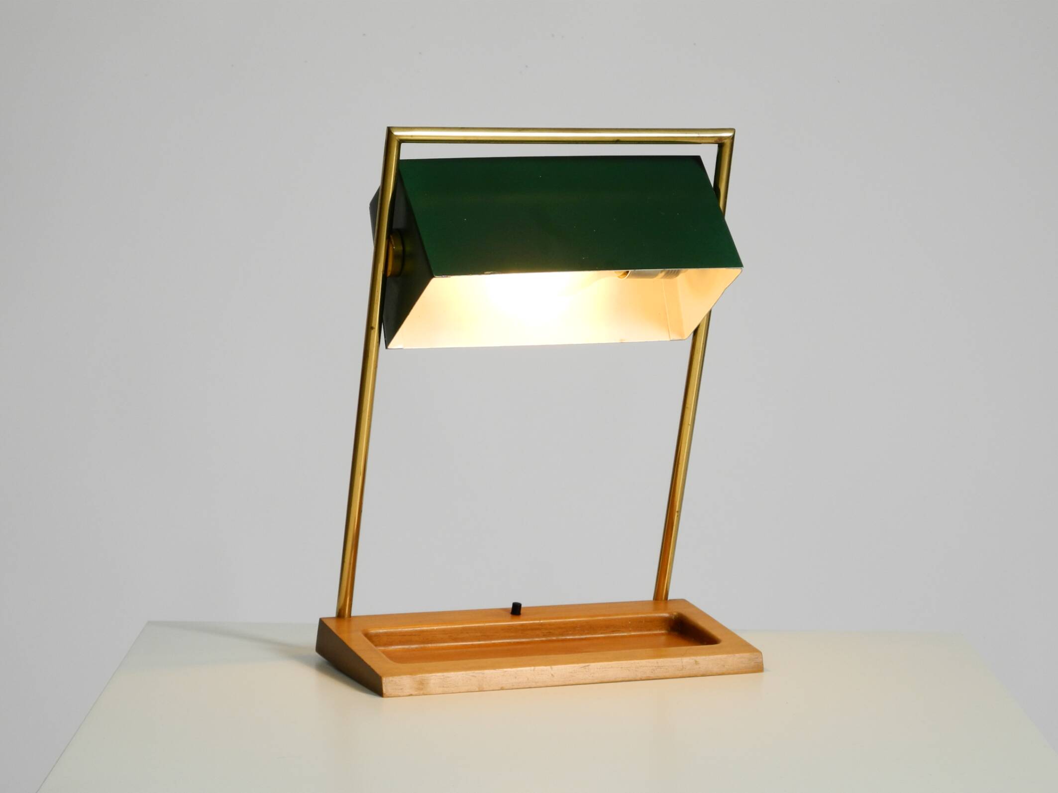 1960s Temde table lamp with a brass frame, teak base, and green lampshade