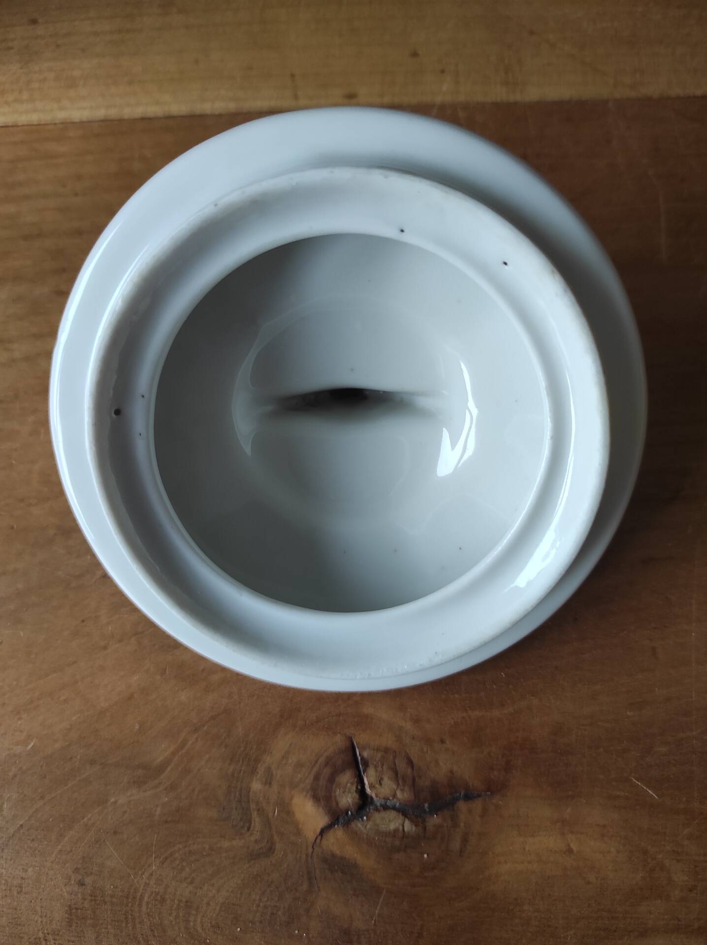 Antique porcelain sugar bowl with a decagonal base.