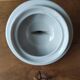 Antique porcelain sugar bowl with a decagonal base.