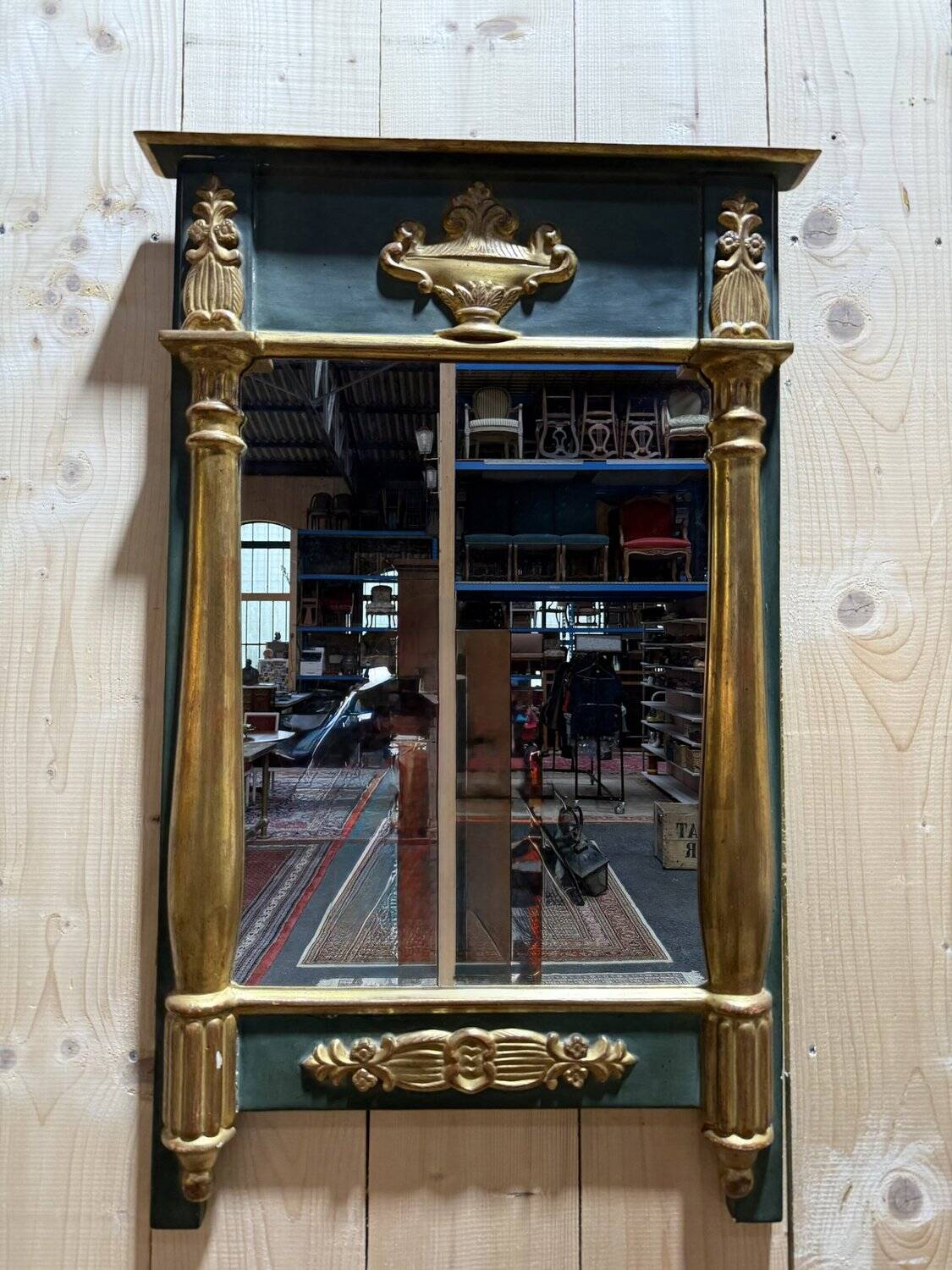 Empire-style mirror in gilded wood