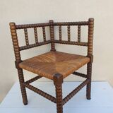 Fauteuil de coin en bois tourné façon chapelet