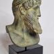 Bust of Poseidon in patinated plaster on wooden base