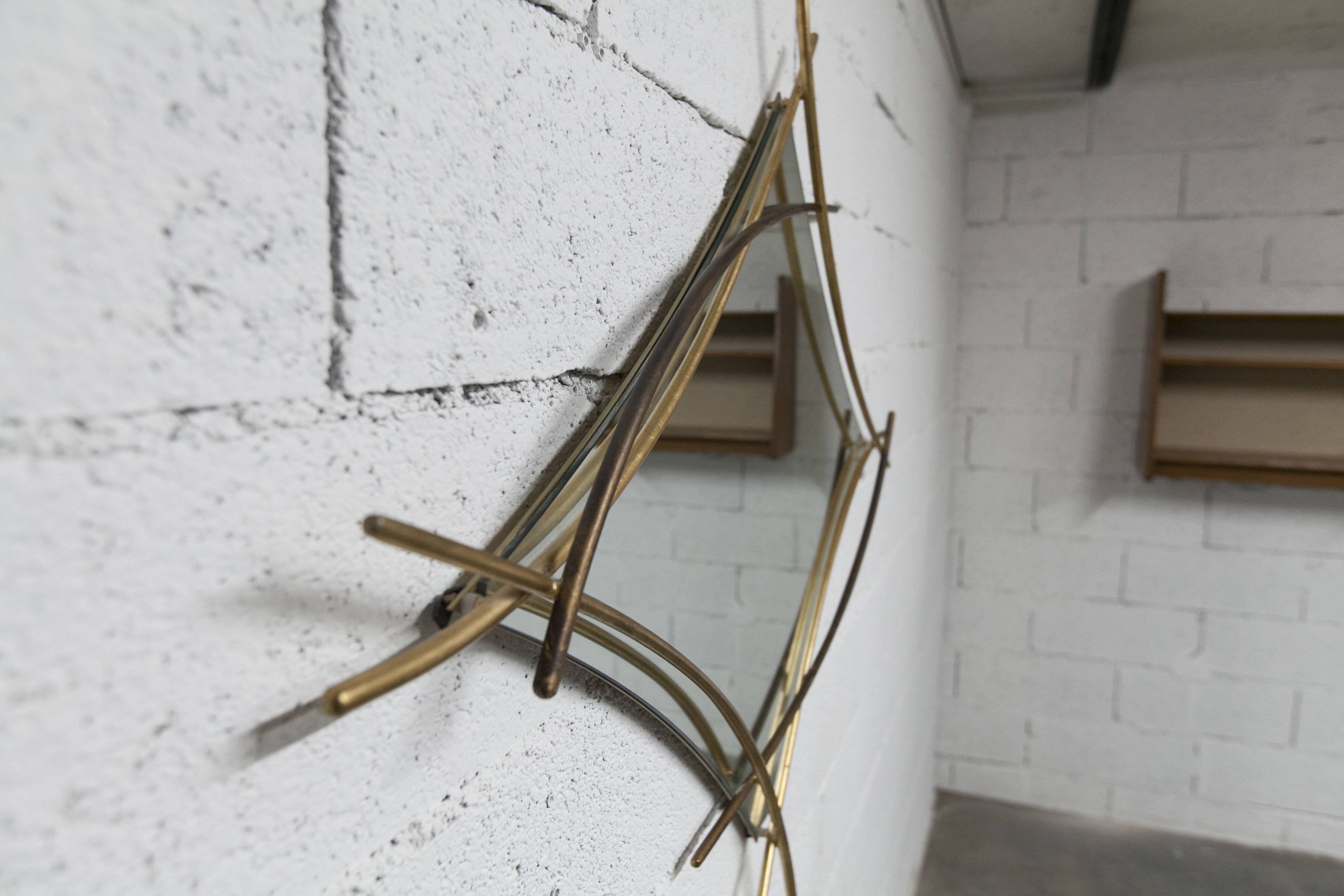 Sculptural mirror with two-tone gilded arches, France, 1970s, 95 x 133 cm