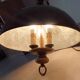 Rustic old wooden and brass suspension.