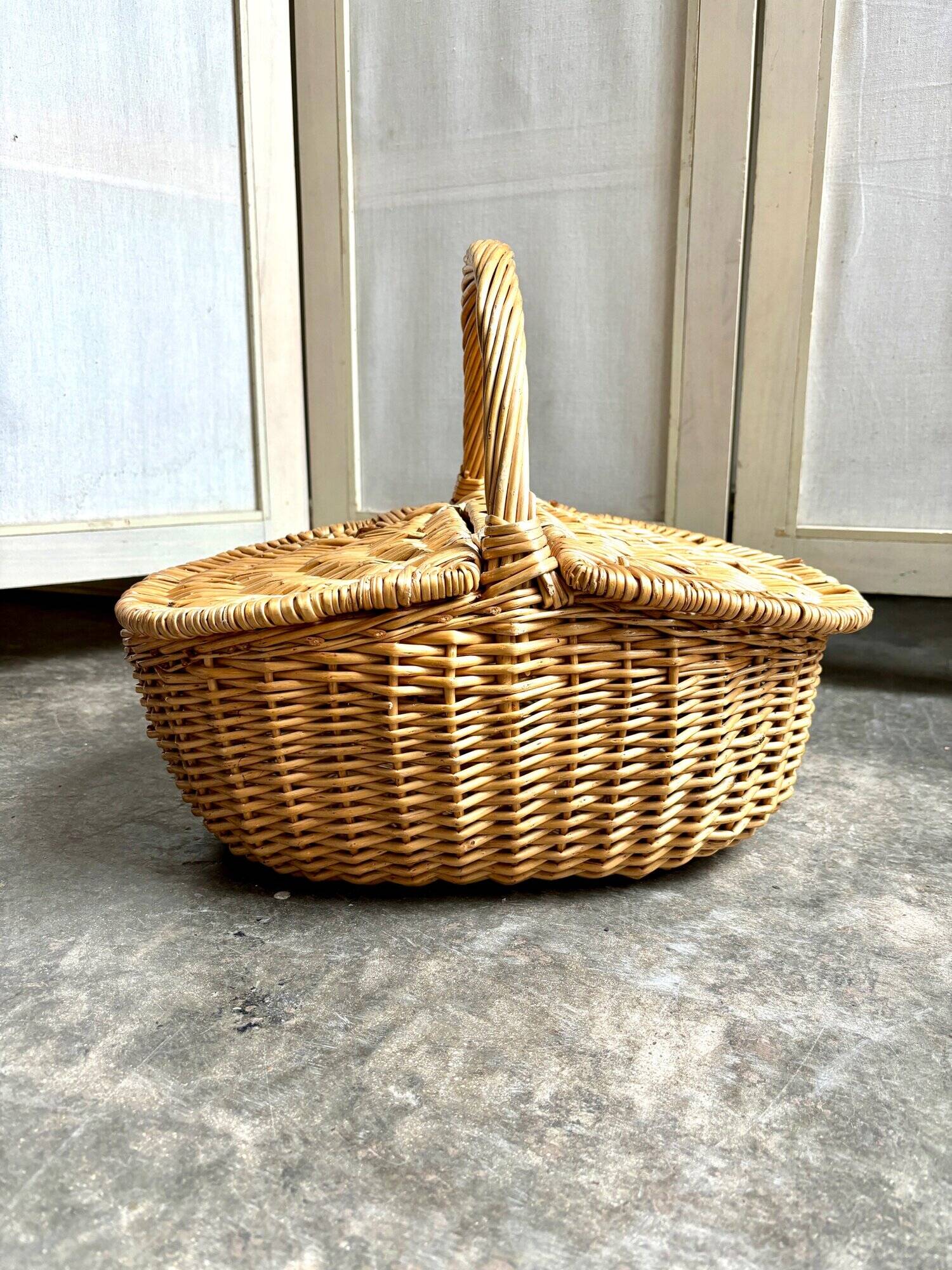 Woven wicker picnic basket