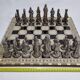 Vintage chess set in patinated metal alloy with a 39 cm chessboard from the 1980s.