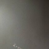 Vintage aluminum wall coat rack.