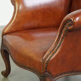 Fauteuil ancien en peau de mouton entièrement restauré
