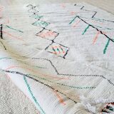White wool Berber rug with fluorescent orange green patterns