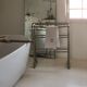 Old bathroom towel rack in patinated wood