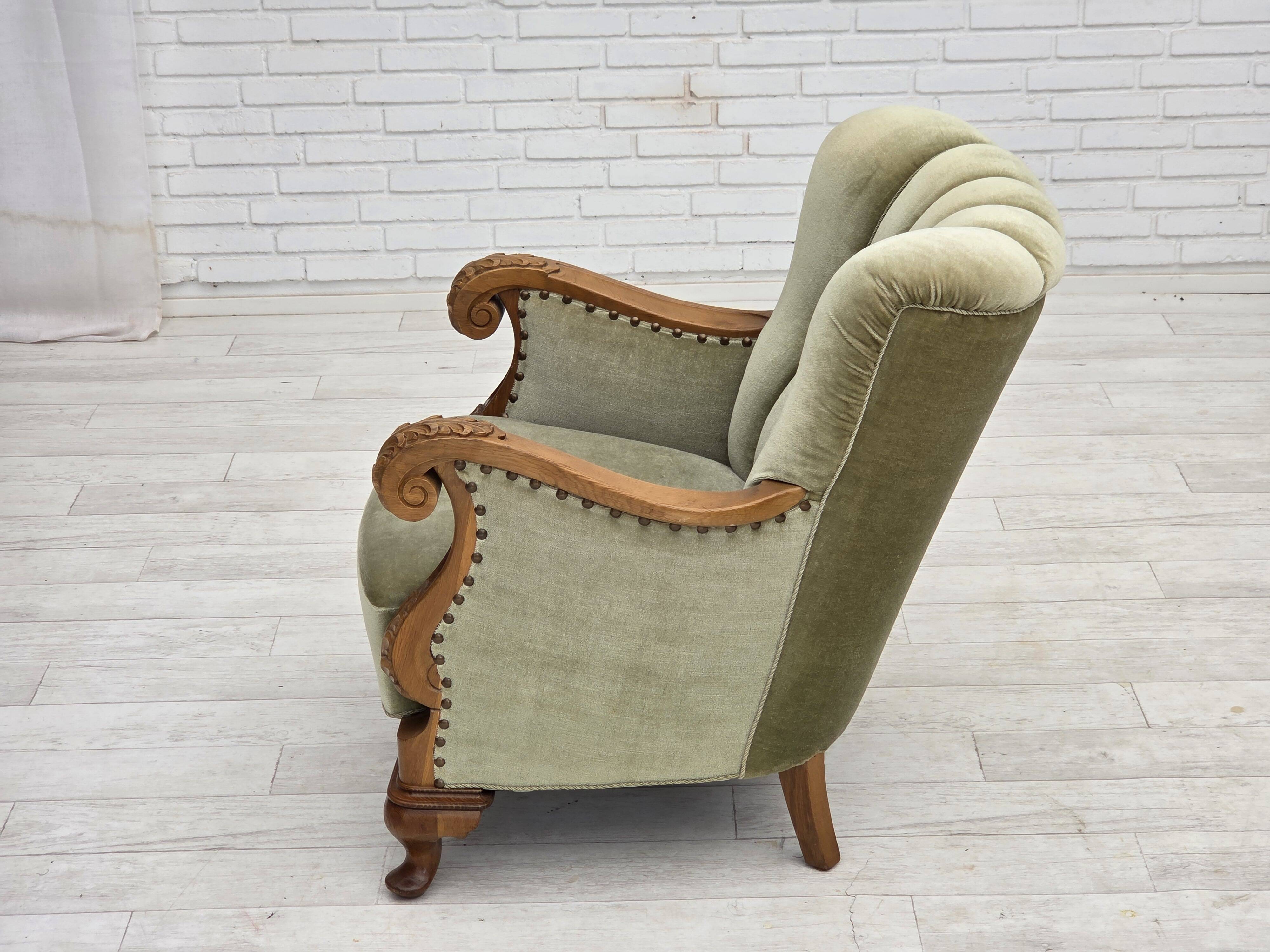 1960s, Danish armchair, green furniture velour, carved oak wood.