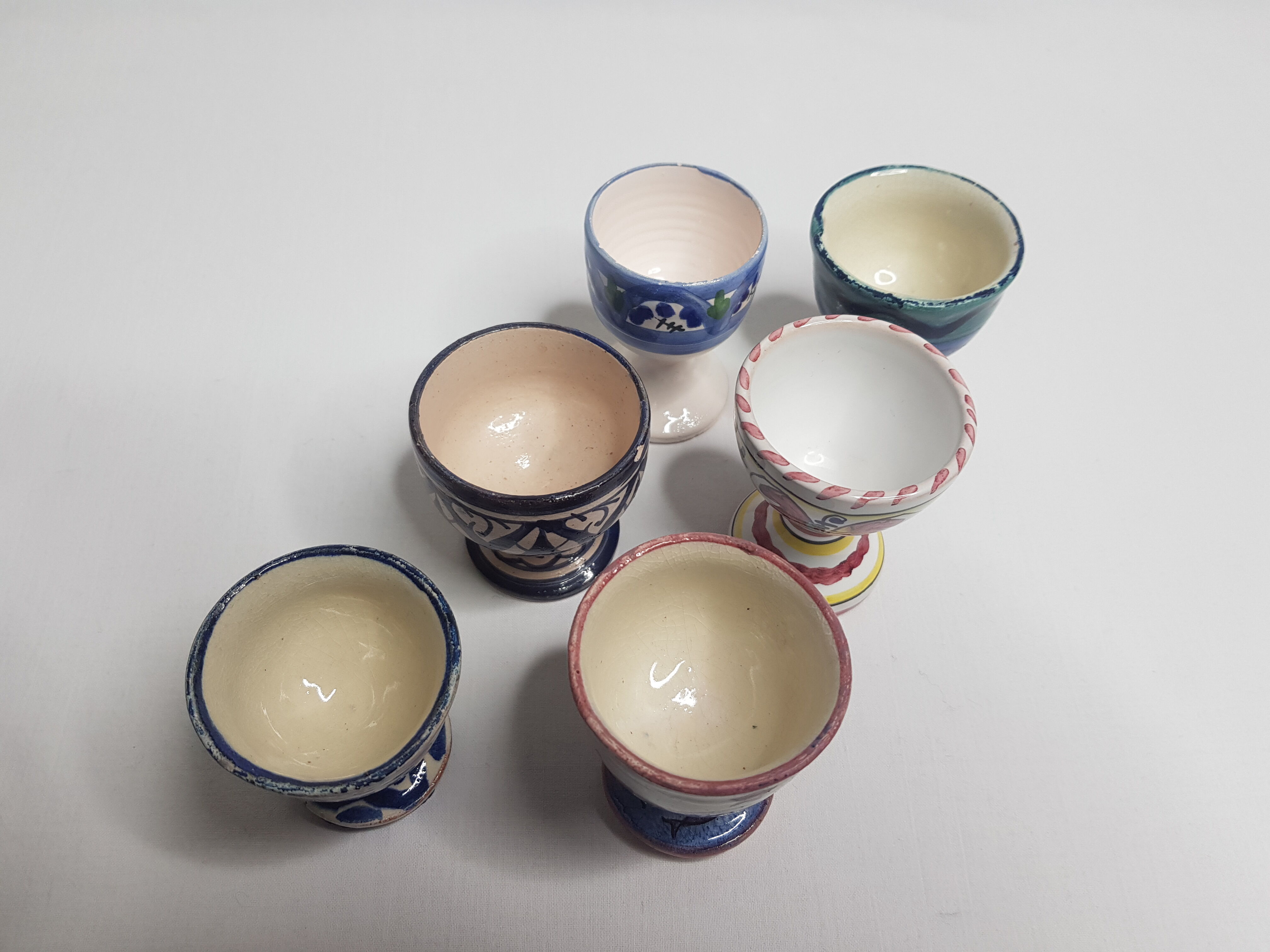 Lot of six enamelled ceramic cockroaches with Mediterranean themed decorations