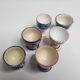 Lot of six enamelled ceramic cockroaches with Mediterranean themed decorations