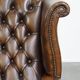 Fauteuil Chesterfield en cuir de vache marron de style anglais