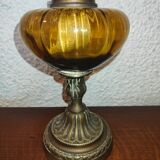 Antique kerosene lamp with yellow glass