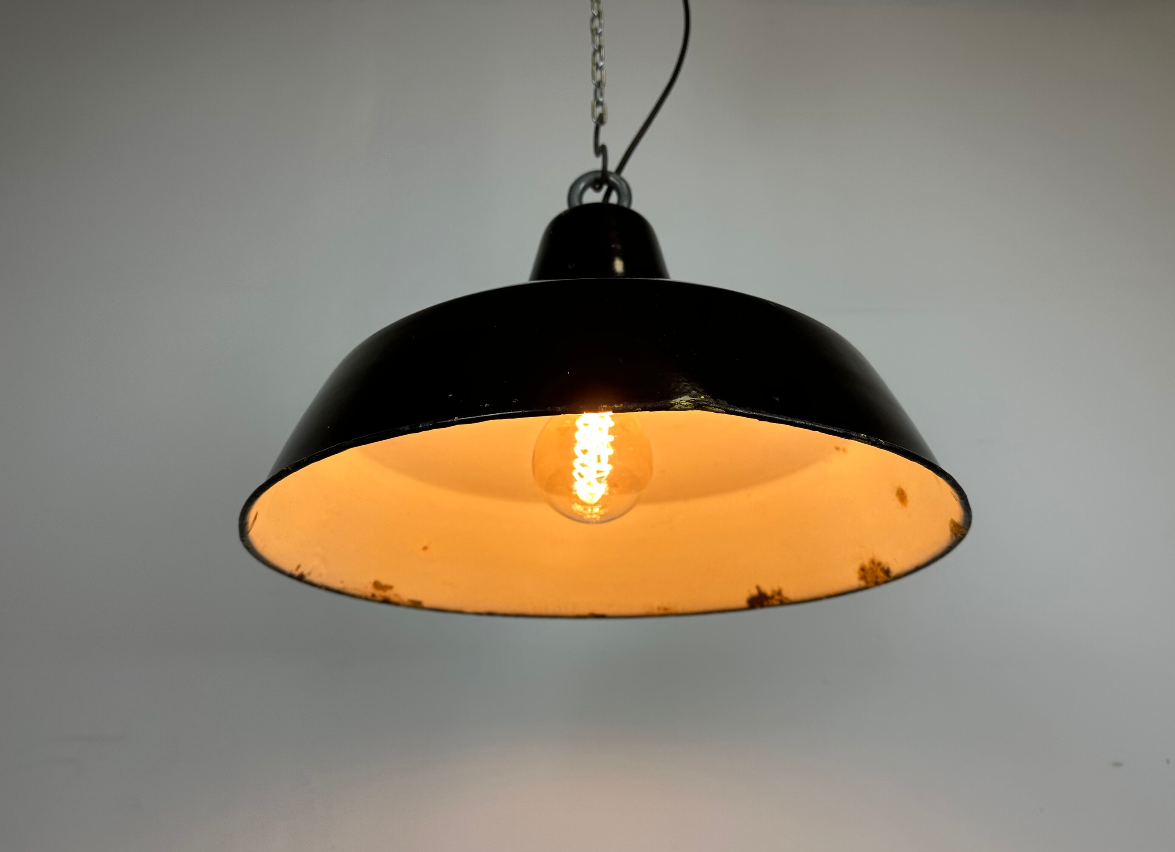Industrial black enamel factory lamp with iron top, 1960s