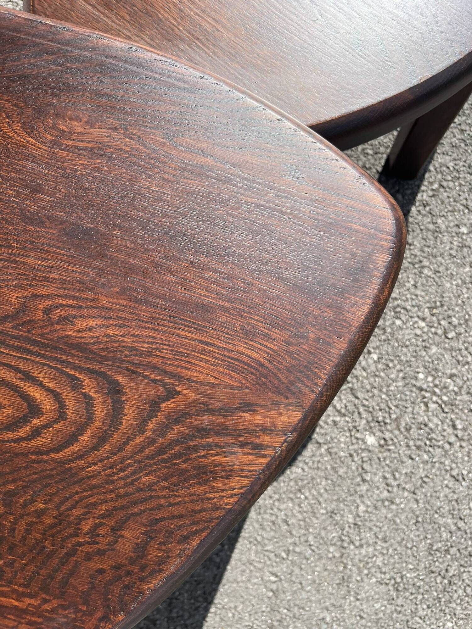 Nested tripod tables made of solid wood, in a modernist brutalist style.