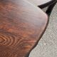 Nested tripod tables made of solid wood, in a modernist brutalist style.