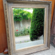 Miroir mural patiné gris à glace biseautée, 80 x 70 cm