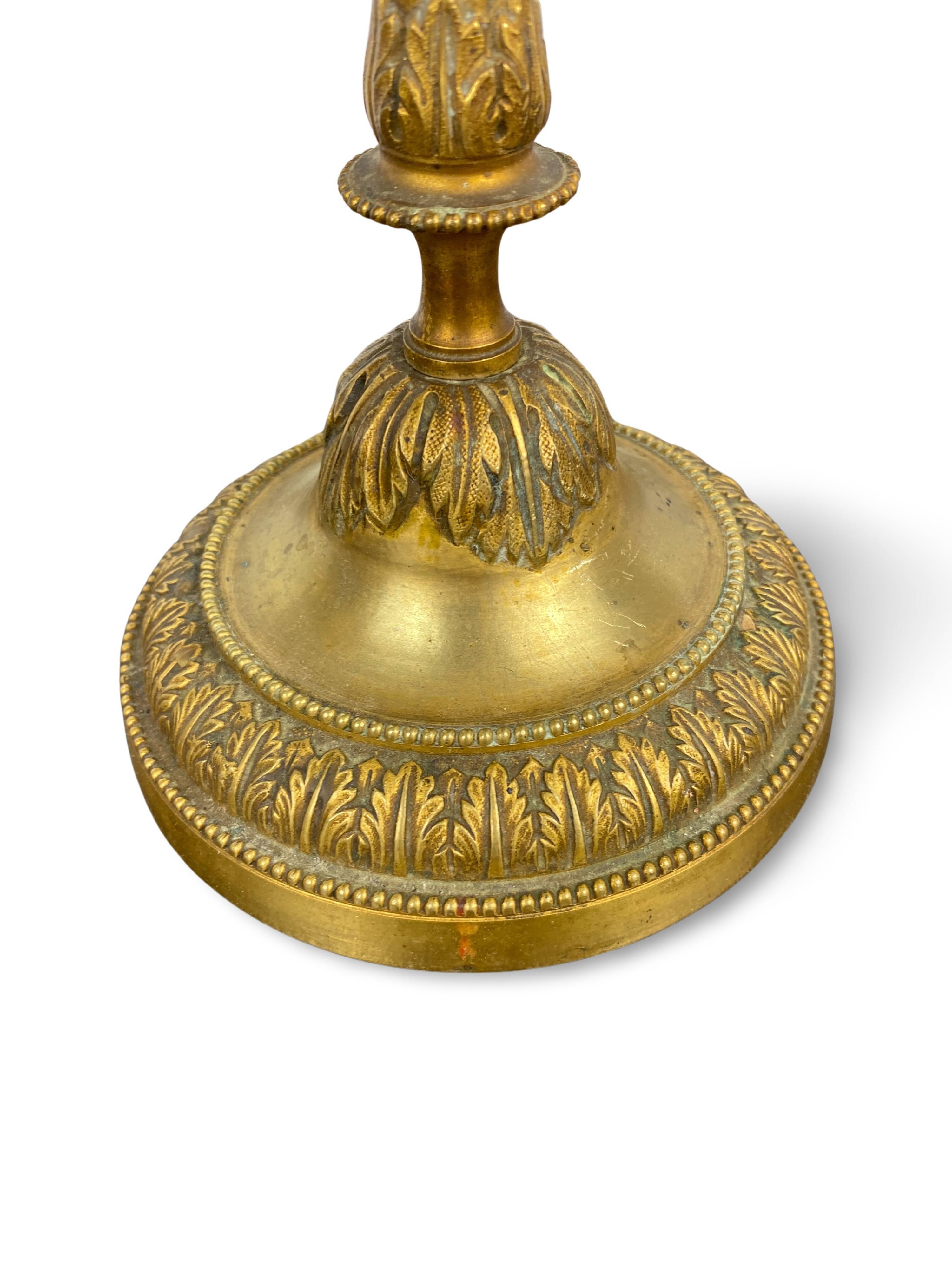 Louis XVI period candlestick in chiseled gilt bronze