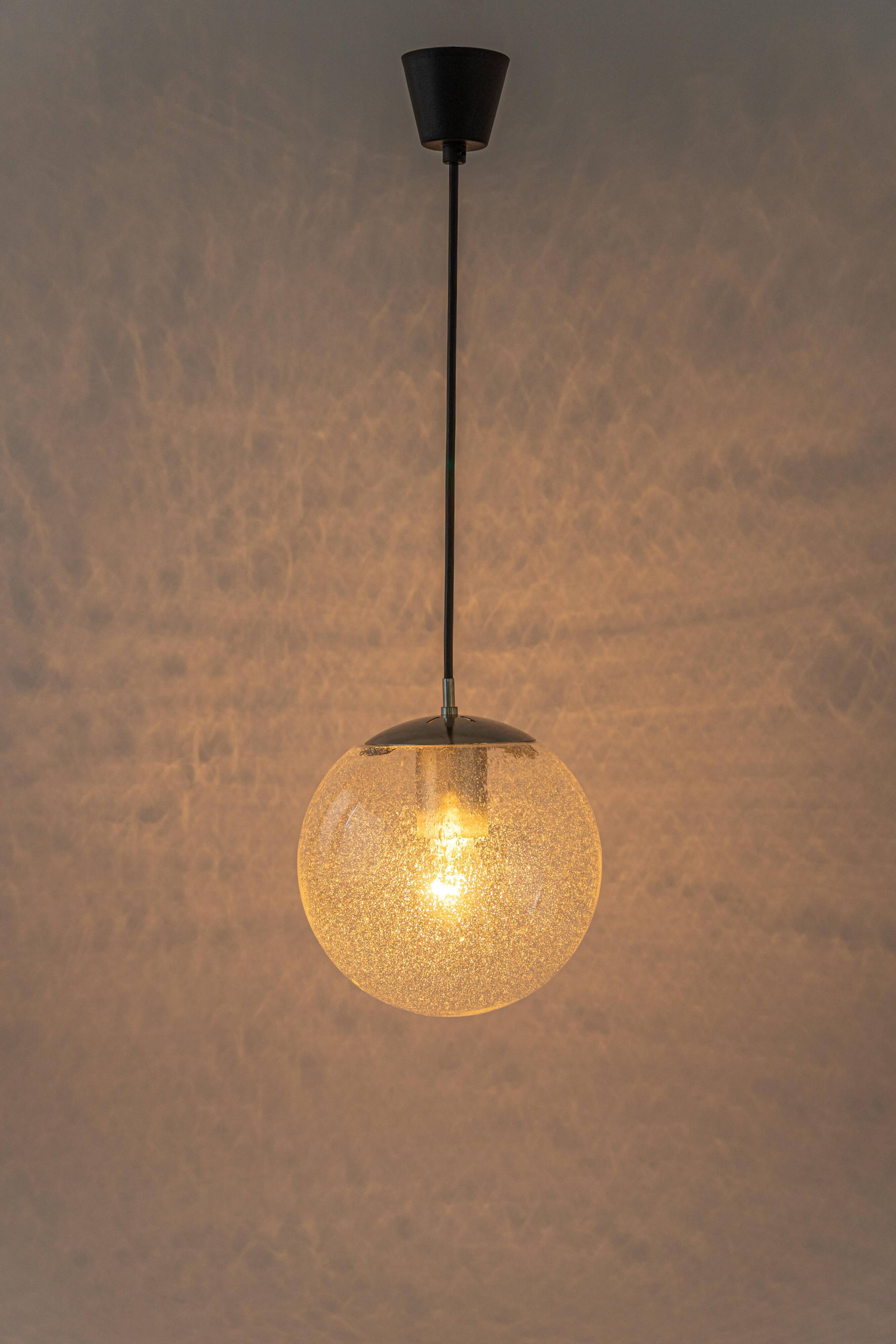 Small Limburg chrome pendant light with transparent glass ball, Germany, 1970s.