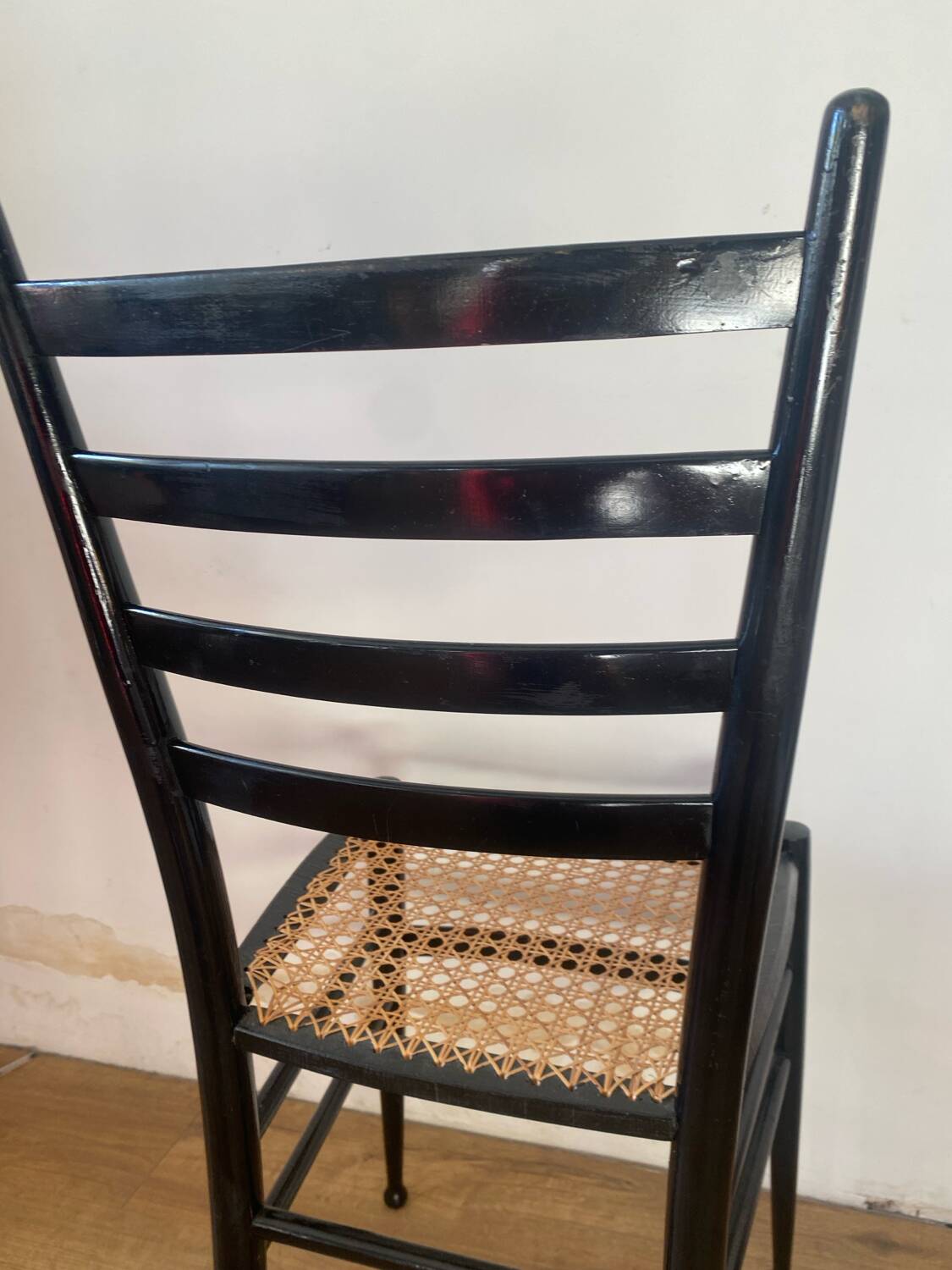 Light wooden chair with caning