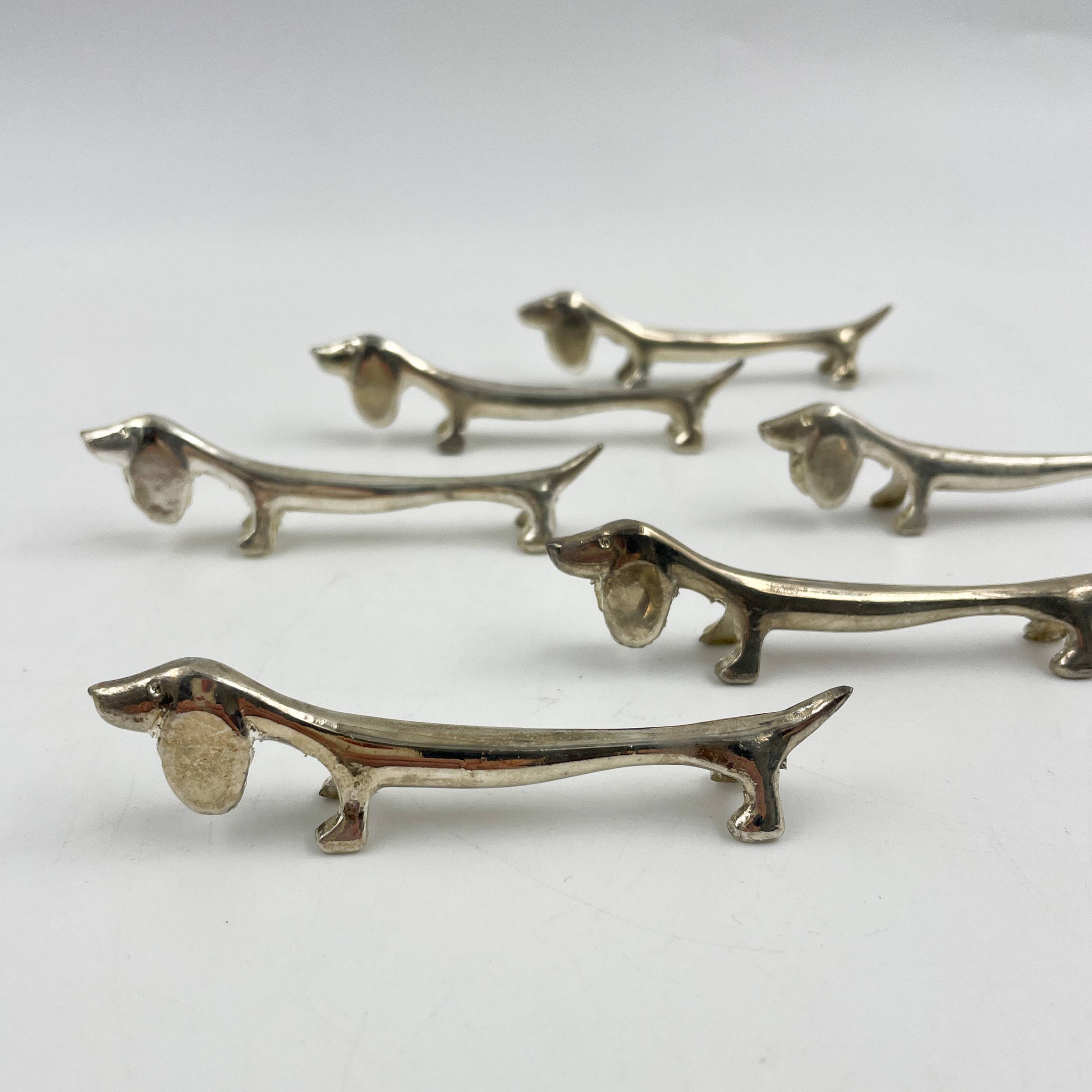 Set of 6 silver metal Dachshund knife holders, 1970s
