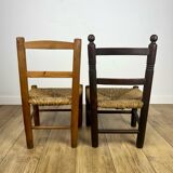 Pair of old wooden and straw children's chairs.
