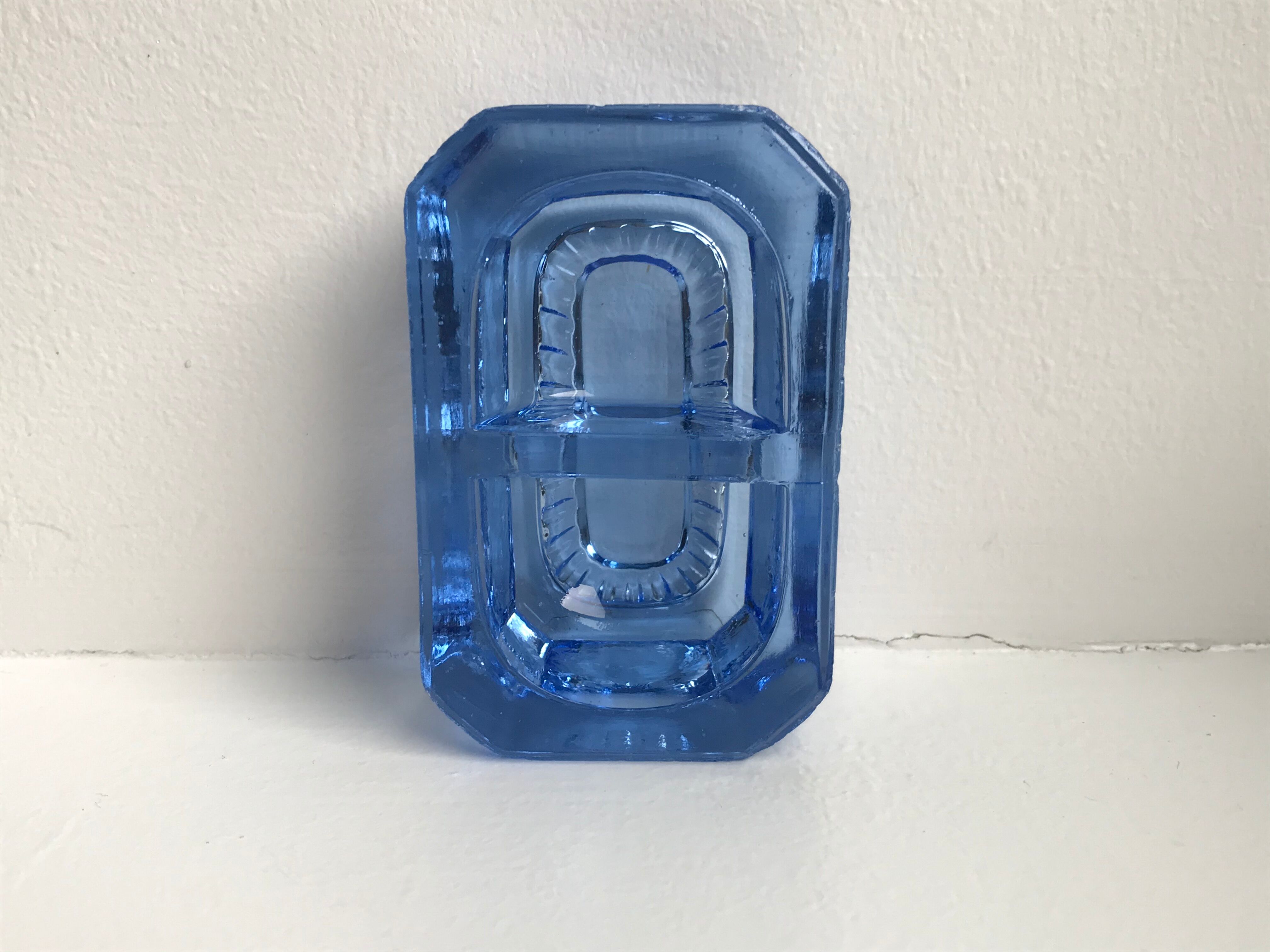 Salt shaker in electric blue molded glass