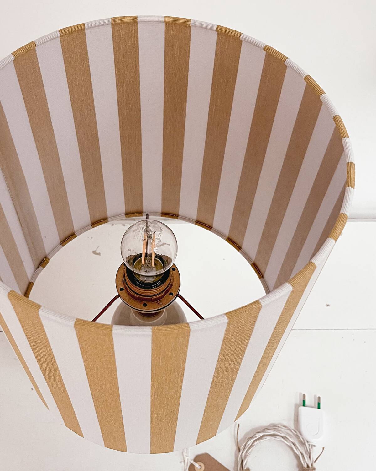 Sandstone lamp and striped lampshade