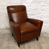 Antique club armchair from the 1950s with compass feet