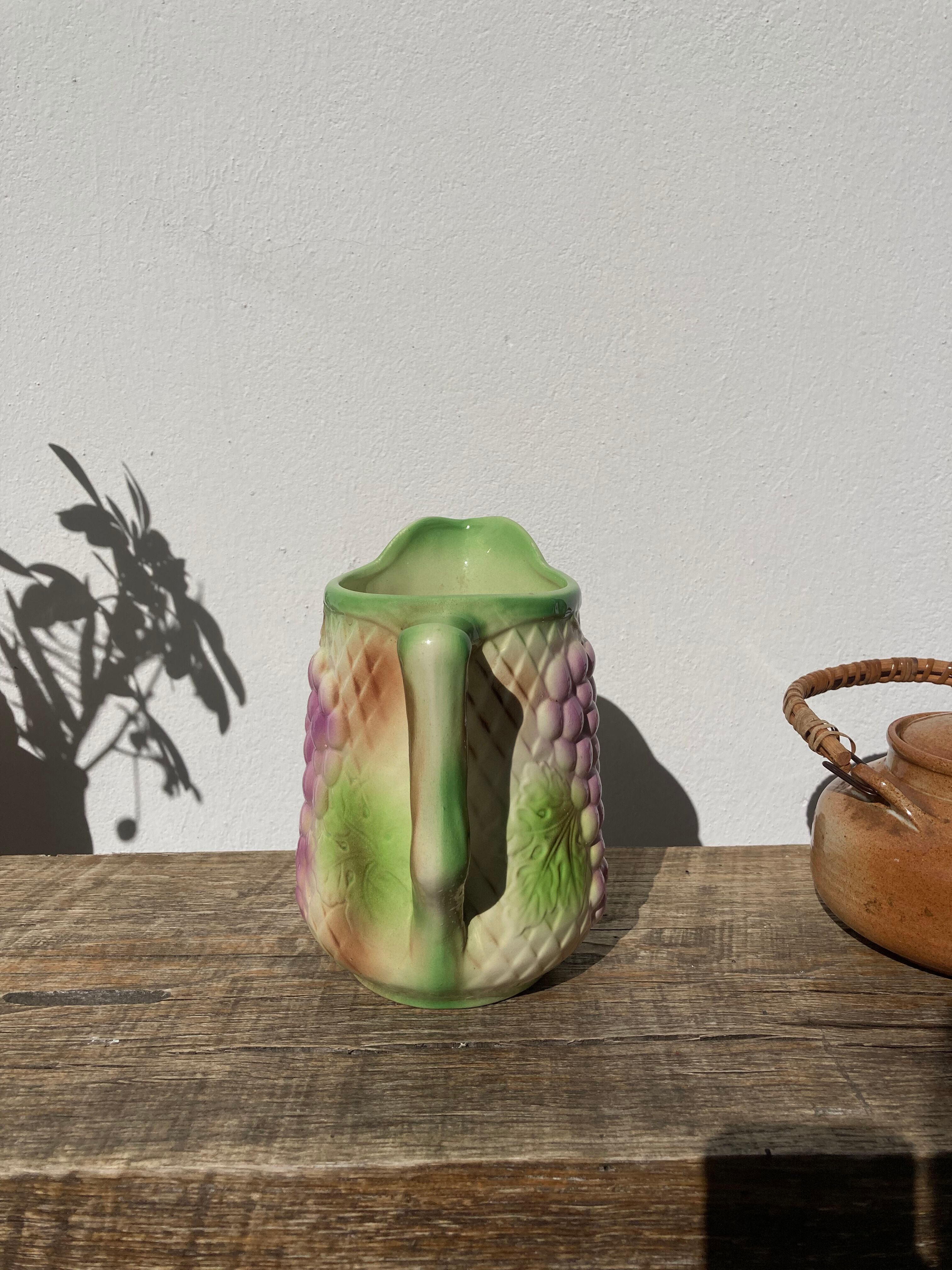 Pitcher in slip - earthenware Saint Clement numbered with fruit and grape basket decoration