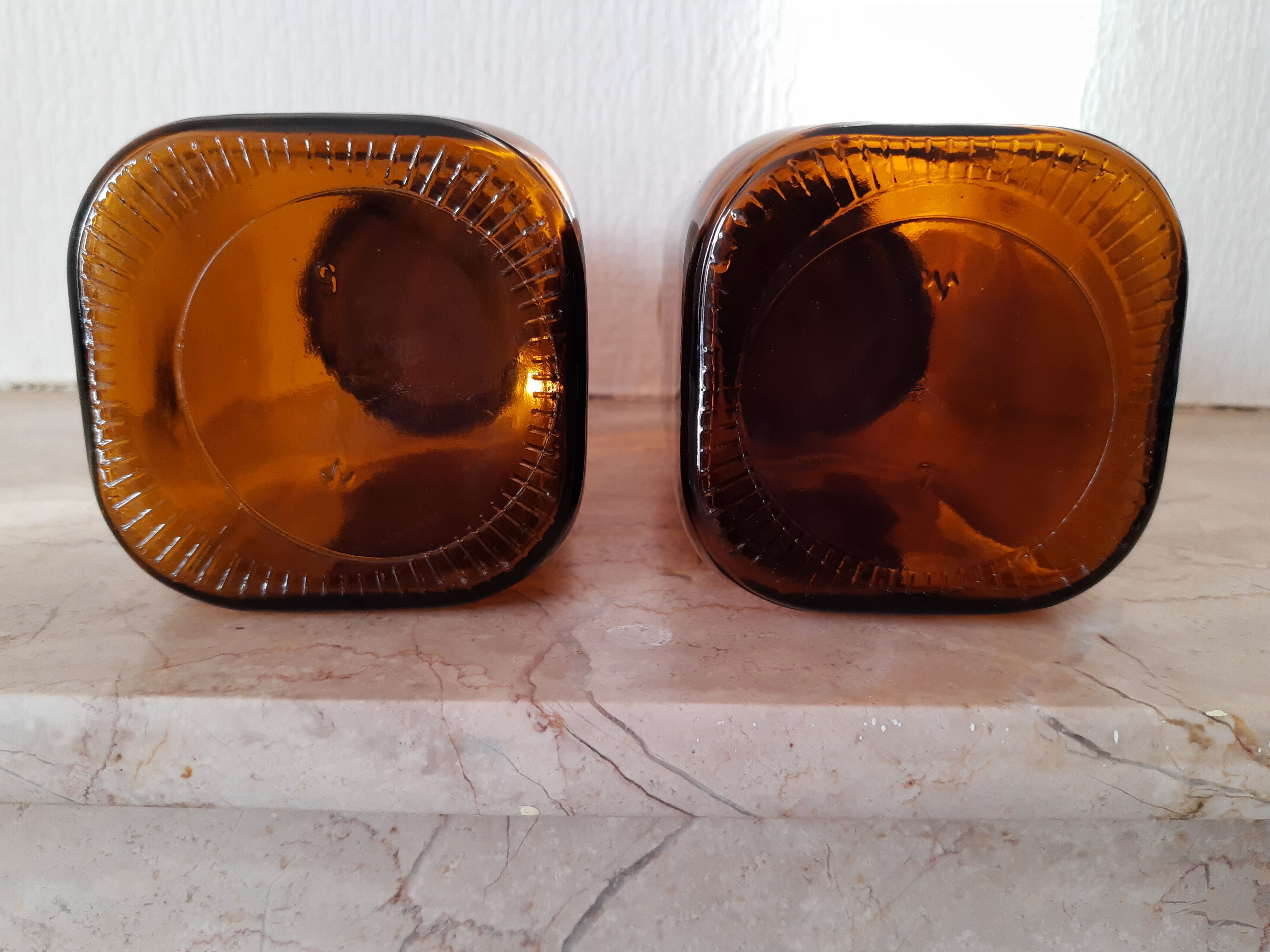 Pair of vintage amber glass jars