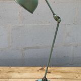 Old green industrial desk lamp