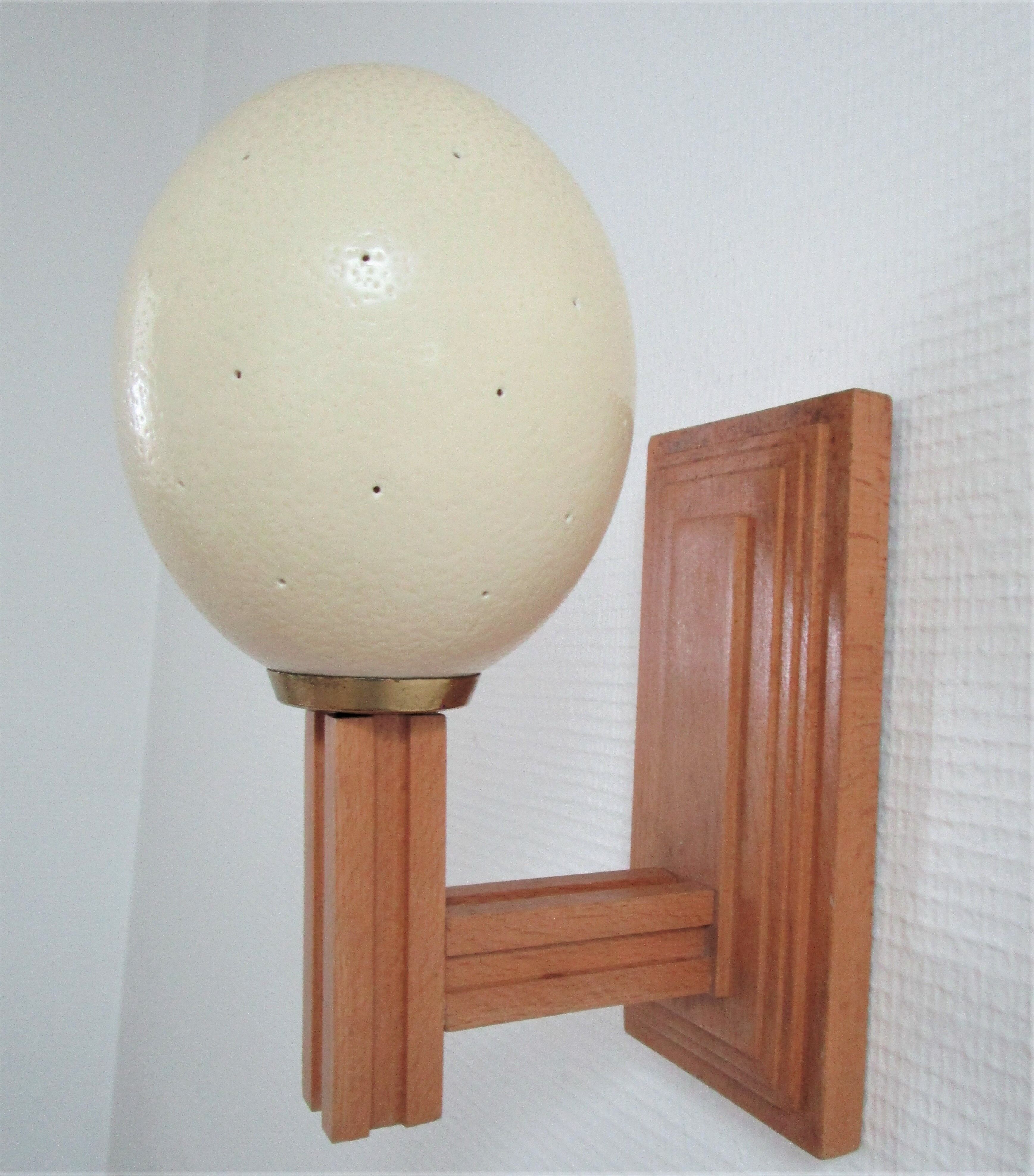 Ostrich egg wall lamp and vintage wood