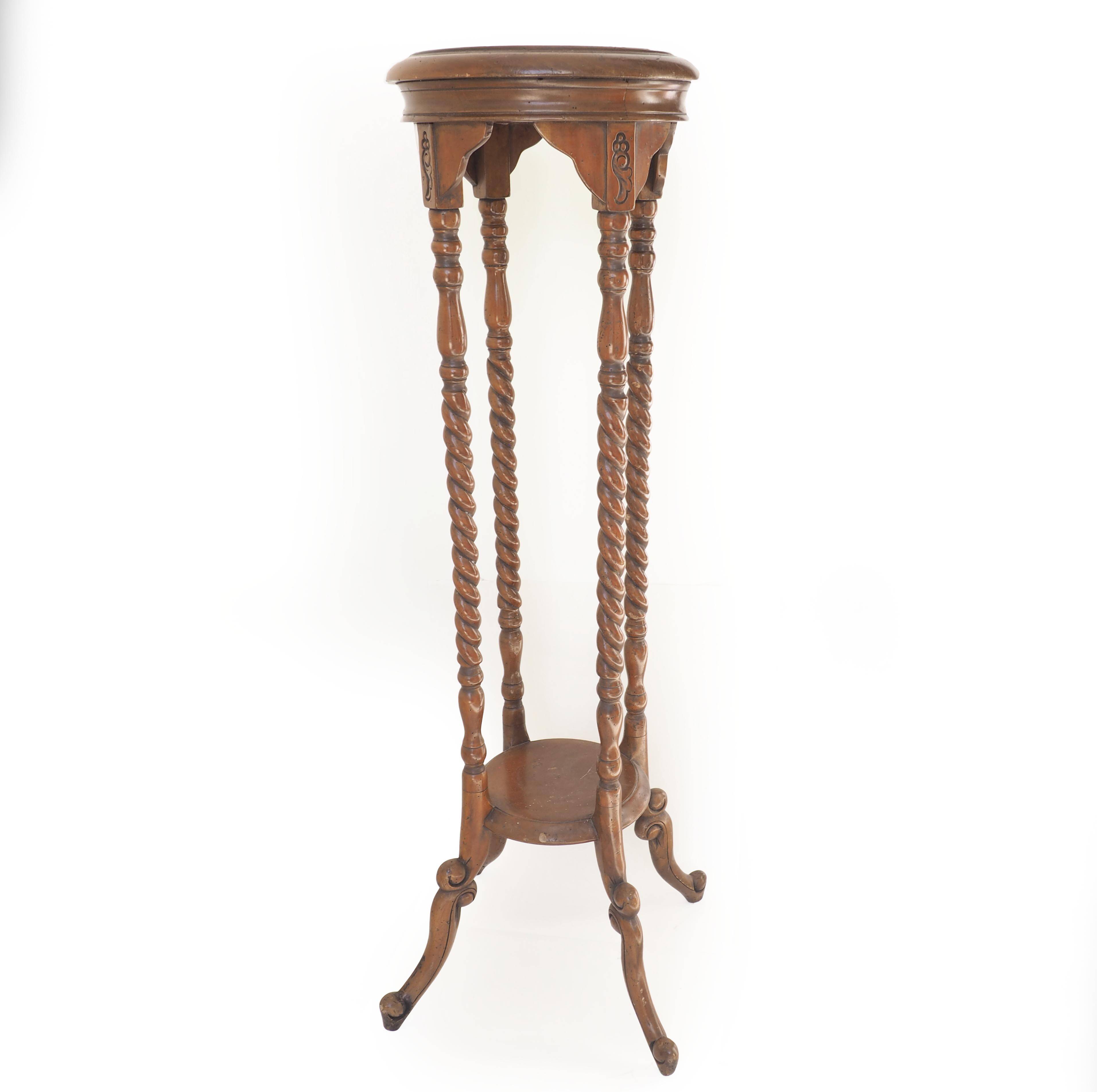 Turned cherry wood pedestal table