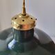 Suspension in enamelled sheet metal and brass