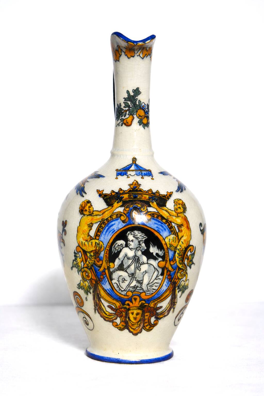 Gien earthenware jug, Renaissance decoration, putto with dolphin.