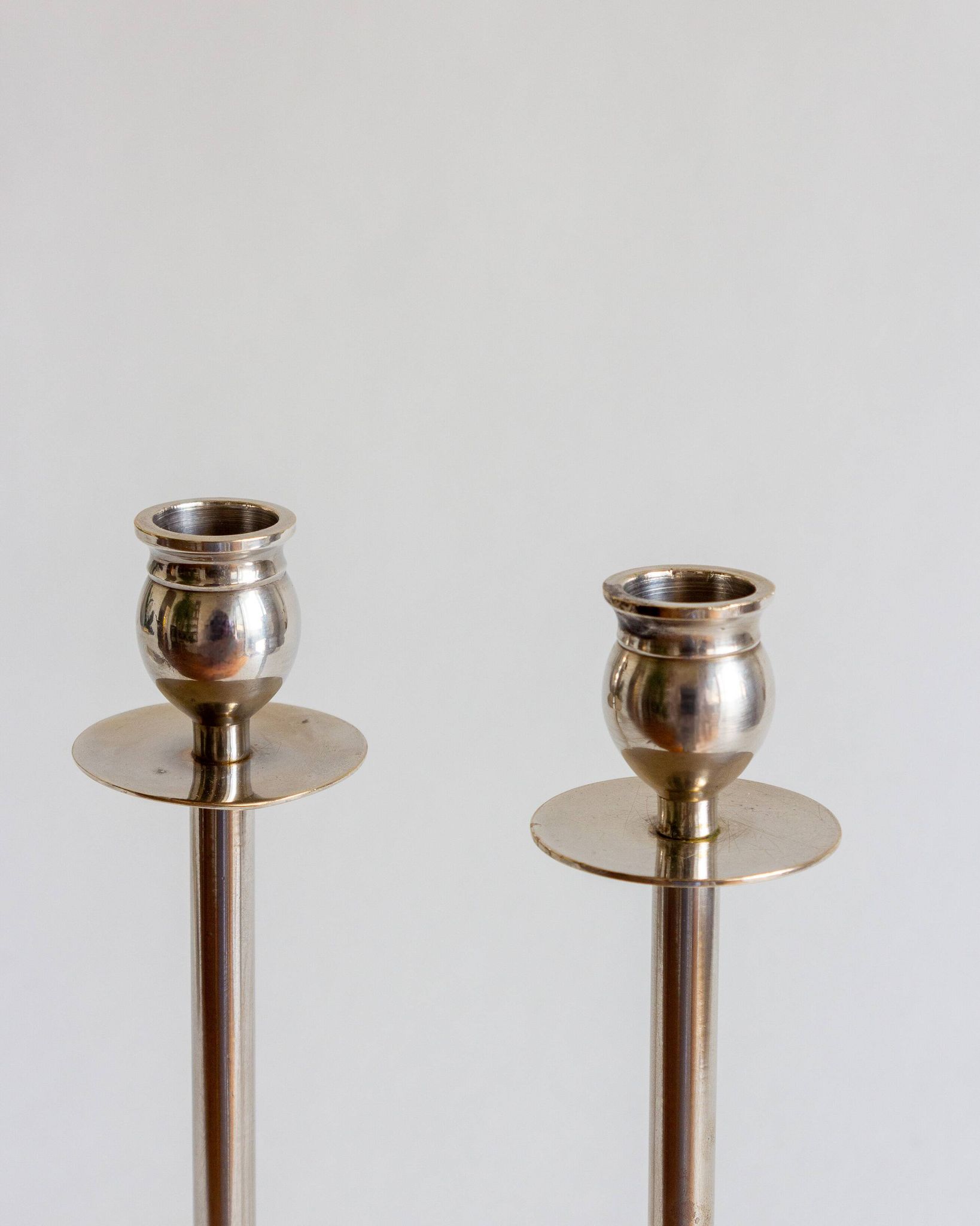 Duo of silver-plated brass candlesticks, 1950s/1960s