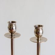 Duo of silver-plated brass candlesticks, 1950s/1960s