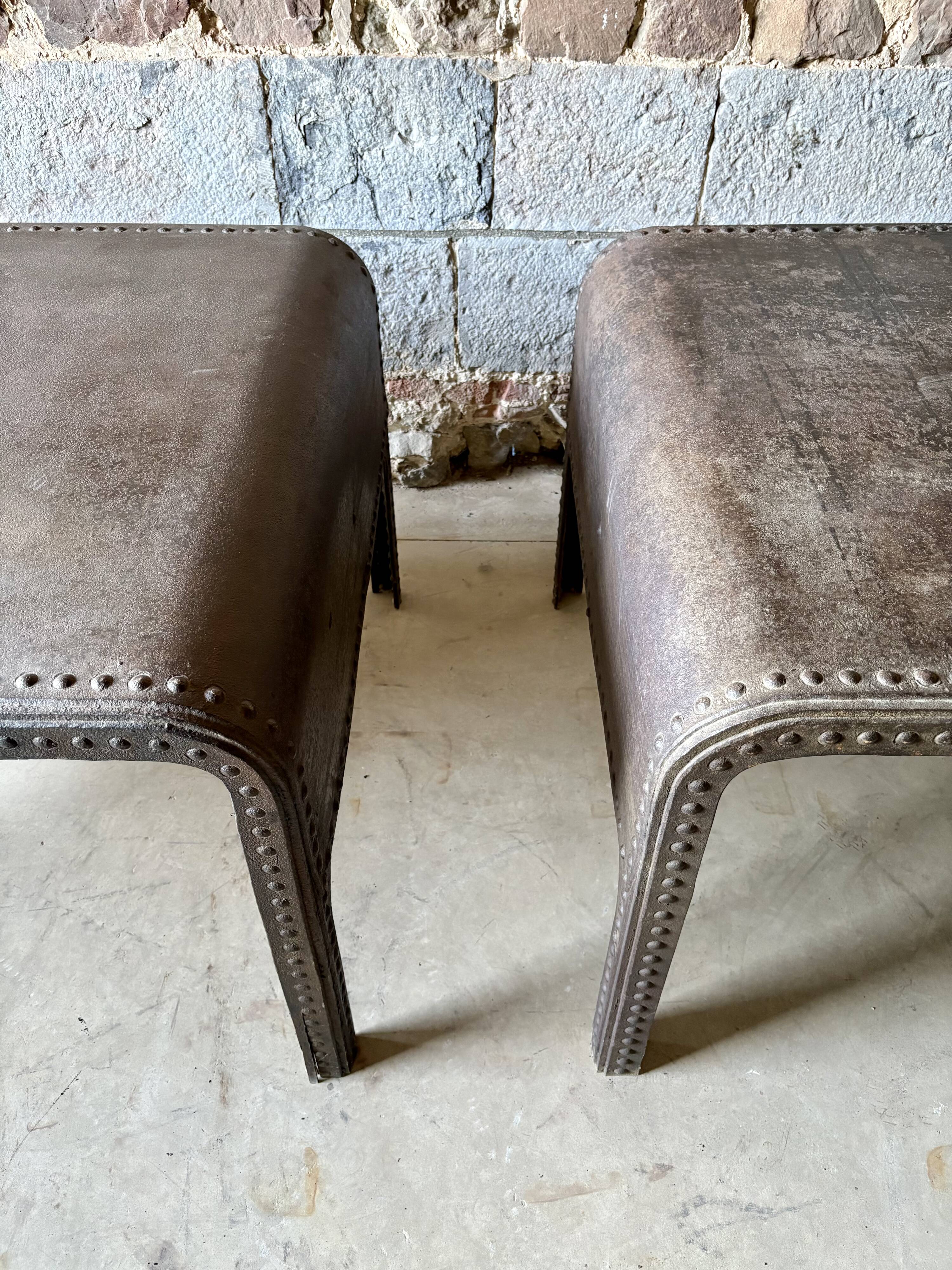 Pair of large riveted metal industrial tables