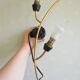 Pair of stylized 2-branch brass wall lights