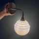 Vintage golden globe elbow wall light in pink and silver Clichy glass