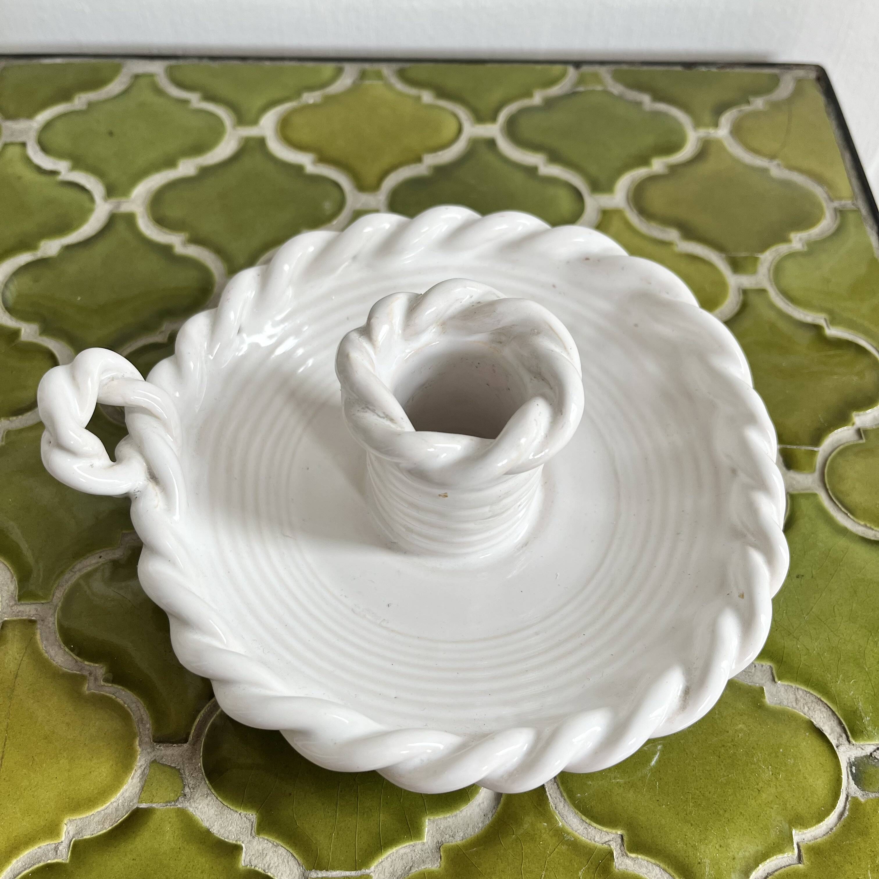 Hand-held candle holder with braided ceramic bowl
