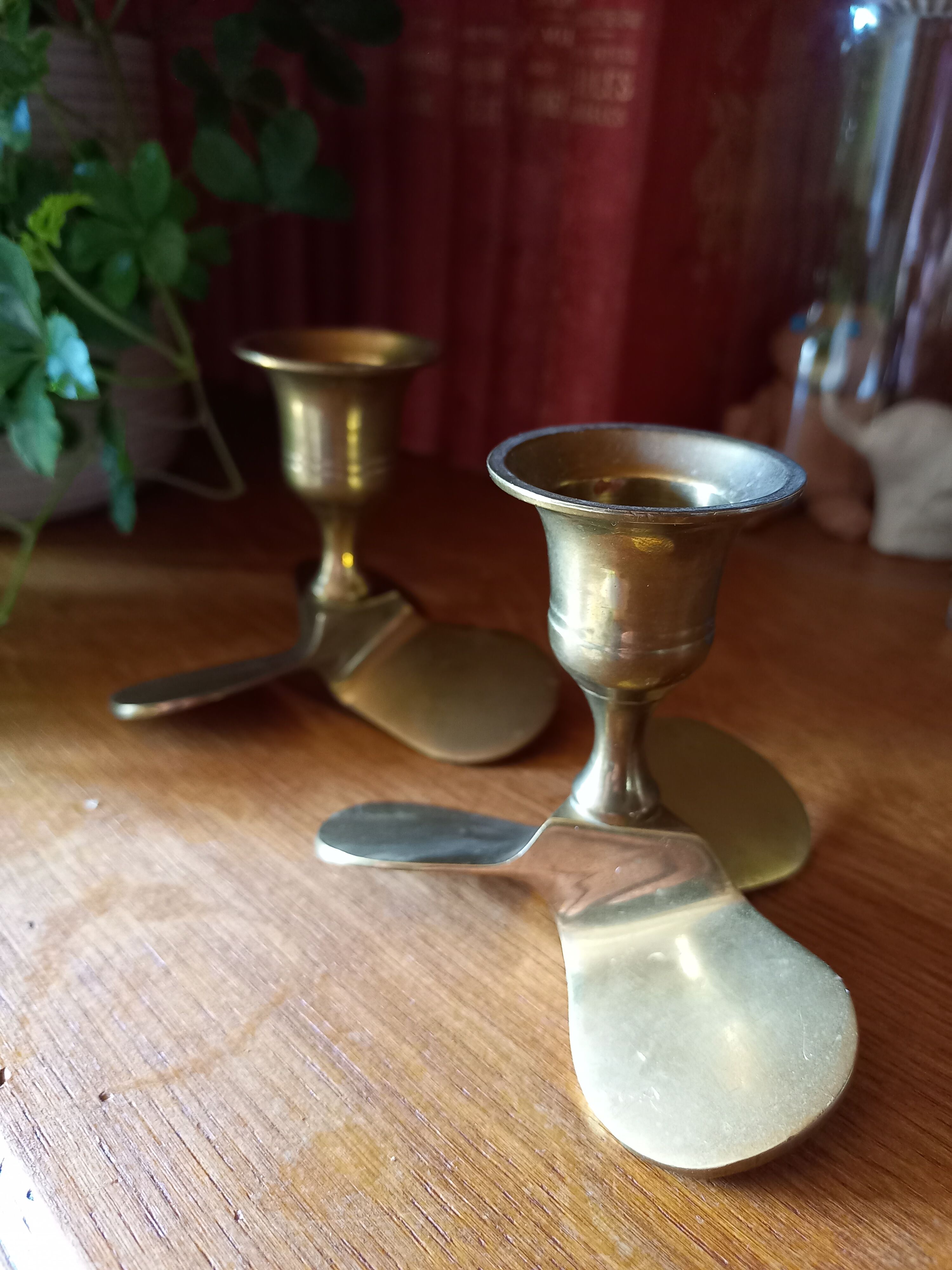 Pair of vintage propeller shape brass candle holders