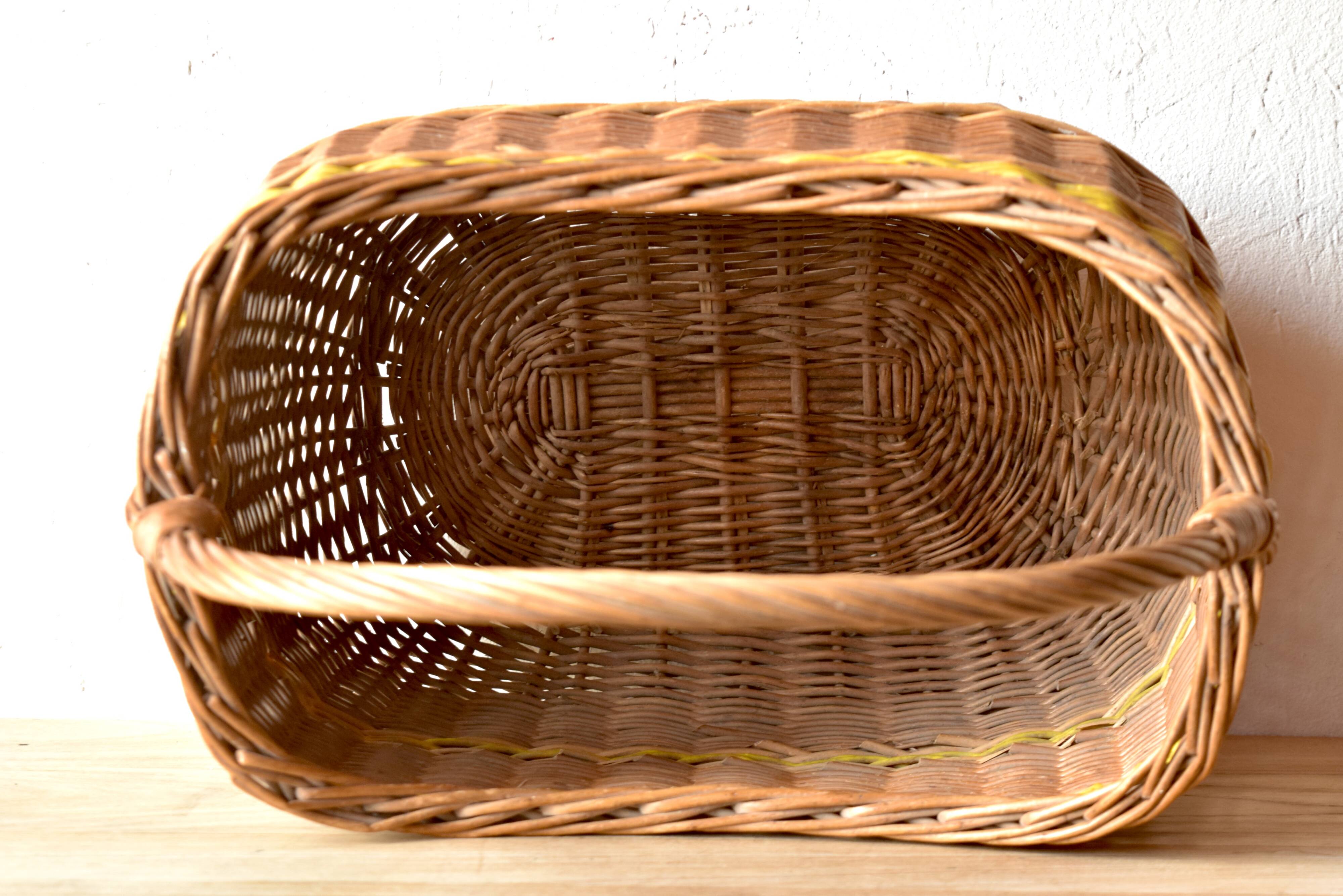 Vintage wicker basket crossed with a yellow scoubidou